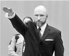  ??  ?? Breivik makes a Nazi salute ahead his appeal hearing at a court at the Telemark prison in Skien, Norway. — AFP photo