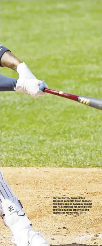  ?? GETTY ?? Gleyber Torres, Yankees’ top prospect, connects on an opposite field home run on Saturday against Tigers, continuing his spring trend of hitting ball the other way and impressing Joe Girardi.