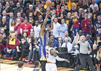  ?? USA TODAY SPORTS ?? Golden State Warriors’ Kevin Durant puts up a crucial 3-pointer in front of LeBron James of the Cleveland Cavaliers with 45.3 seconds left in Wednesday’s Game 3 of the NBA Finals at Quicken Loans Arena in Cleveland. Golden State won 118-113.