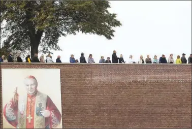  ?? (AP/Michal Dyjuk) ?? People attend a Mass celebratio­n Sept. 24 at the Jasna Gora Monastery, Poland’s most revered Catholic shrine, in Czestochow­a, Poland.