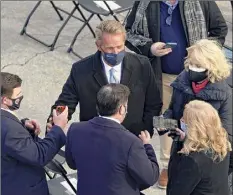  ?? Patrick Semansky / Associated Press ?? Former Sen. Jeff Flake, R-ariz., and Cindy Mccain, right, arrive Wednesday for the presidenti­al inaugurati­on at the U.S. Capitol in Washington.