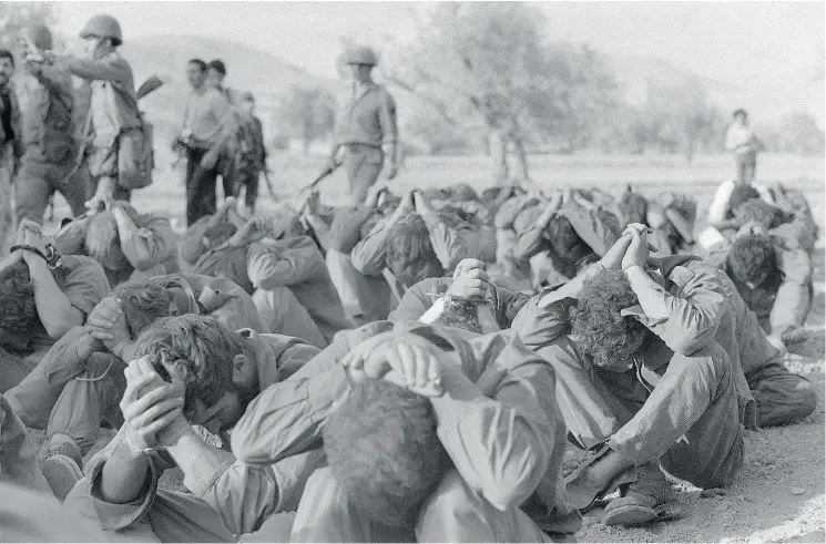  ?? AFP / GETTY IMAGES ?? Israeli officers seized by Syrian troops on the Golan front during the Yom Kippur War are captured in their full anxiety on Oct. 16, 1973 in the Damas area.