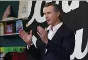  ?? RICH PEDRONCELL­I — THE ASSOCIATED PRESS ?? Gov. Gavin Newsom holds a news conference at the Display California store in Sacramento.