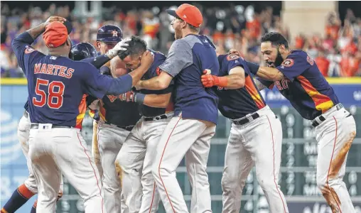  ?? Michael Ciaglo / Houston Chronicle ?? Despite a roster riddled with injuries, the resilient Astros managed to pull off a memorable four-run rally to win Sunday’s homestand finale against Toronto. The real test, however, will come during the crucible of October.