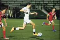  ?? Christian Abraham / Hearst Connecticu­t Media ?? Fairfield Ludlowe’s James Radman drives the ball towards the goal during the FCIAC East boys soccer championsh­ip against Fairfield Prep in Fairfield, Conn., on Tuesday Nov. 10, 2020. The junior striker scored the only goal of the game as the Falcons beat Fairfield Prep 1-0.