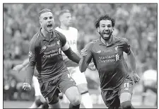  ?? AP/FELIPE DANA ?? Liverpool’s Mohamed Salah (right) celebrates after scoring in the first half of Liverpool’s victory over Tottenham Hotspur on Saturday in the UEFA Champions League final at Madrid.