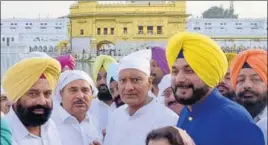  ?? SAMEER SEHGAL/HT ?? Punjab Congress chief and party candidate for Gurdaspur Lok Sabha bypoll, Sunil Jakhar, with minister Navjot Singh Sidhu (right) and (from left) MLAs Sukhbinder Singh Sarkaria and OP Soni, at Golden Temple in Amritsar on Thursday.