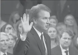  ?? J. SCOTT APPLEWHITE | ASSOCIATED PRESS ?? PRESIDENT DONALD TRUMP’S Supreme Court nominee Brett Kavanaugh is sworn in before the Senate Judiciary Committee in Washington. He faces allegation­s of decades-old sexual misconduct from his high school days.