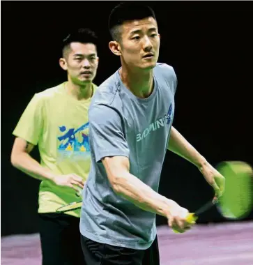  ??  ?? Hard at work: Chen Long (right) and Lin Dan of China at a training session on Saturday.