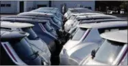  ?? DAVID GOLDMAN — THE ASSOCIATED PRESS ?? Nissan electric vehicles sit on display at an auto dealership in Roswell, Ga.