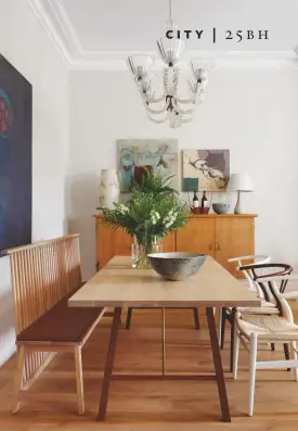  ??  ?? DINING ROOM A bench gets more people around the table. This space is almost open-plan to the kitchen thanks to a wide opening (right). The antique cabinet (also right) provides elegant storage.