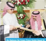  ??  ?? His Highness the Crown Prince Sheikh Nawaf AlAhmad Al-Jaber Al-Sabah signs the guestbook during his visit to the Kuwait Club for the Deaf.