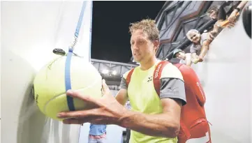  ??  ?? Tennys Sandgren of the US signs autographs after defeating Switzerlan­d’s Stan Wawrinka. — Reuters photo