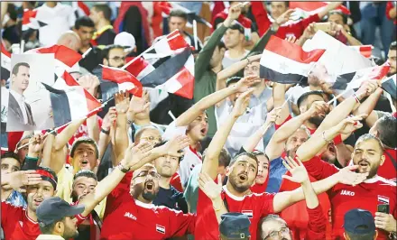  ??  ?? Syria’s national soccer team celebrates at the conclusion of their match with Iran which drew 2-2 during their Round 3 — Group A World Cup qualifier atthe Azadi Stadium in Tehran, Iran on Sept 5. (AP)