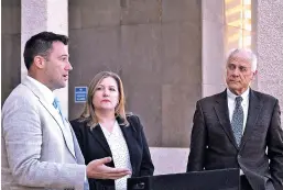  ?? MARY HUDETZ/THE ASSOCIATED PRESS ?? Albuquerqu­e City Councilor Pat Davis, left, discusses a proposal to decriminal­ize possessing an ounce of marijuana or less on Monday with Emily Kaltenbach, of the Drug Policy Alliance, center, and fellow Councilman Isaac Benton, right, at a news...