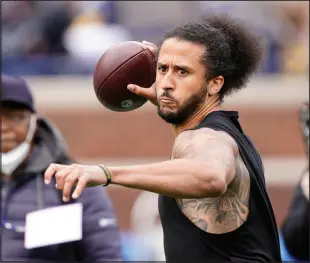  ?? CARLOS OSORIO / ASSOCIATED PRESS FILE ?? Colin Kaepernick throws
April 2 during halftime of college football intrasquad spring game in Ann Arbor, Mich. This week, he got a chance to work out for the Las Vegas Raiders after six years away from the NFL.