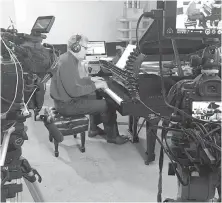  ??  ?? Composer-pianist Karel Roessingh records in the View Street parkade.