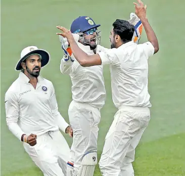  ?? — AP ?? KL Rahul, Rishabh Pant and R. Ashwin celebrate Australia’s final wicket in the first Test at Adelaide on Monday.