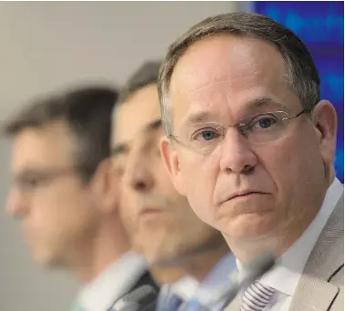  ?? ADRIAN WYLD/The Canadian Press ?? Bell Media president Kevin Crull listens to an associate make a presentati­on during CRTC hearings Wednesday.