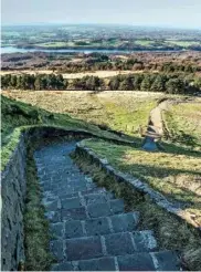  ??  ?? The descent down frosty steps from the Pike affords views over the fields and Lower Rivington Reservoir.