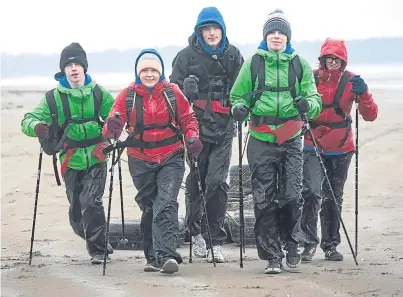  ?? Picture: Tina Norris. ?? From left: Connor Harper, Hannah Reid, Daniel Pratt, Keiran Burns and Carrie Wotherspoo­n taking part in endurance training in St Andrews.