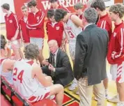  ?? Peter Wallace/For Hearst Connecticu­t Media ?? Wamogo coach Gregg Hunt talks with his team against Somers in the Division IV tournament on Wednesday night.