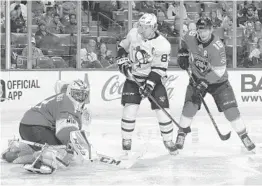  ?? JOEL AUERBACH/AP ?? Florida Panthers center Aleksander Barkov (16) looks on as goaltender Roberto Luongo turns away a shot by Pittsburgh Penguins center Sidney Crosby in Saturday’s game.