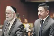  ?? Al Seib Los Angeles Times ?? ATTORNEY Michael Schwartz, left, and L.A. County Sheriff ’s Deputy Luke Liu appear in court.