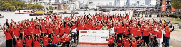  ?? Photo by SamJPeat ?? ON THEIR BIKES: Santander staff have raised £167,000 for charity with their big sponsored cycle across London – the ride also promoted cycling as a healthy way to travel