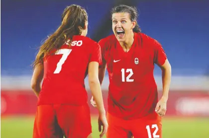  ?? FRANCOIS NEL/GETTY IMAGES ?? Christine Sinclair, right, celebrates with Julia Grosso over Team Canada's first Olympic gold for women's soccer.