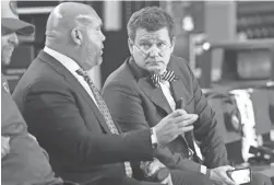  ?? MICHAEL CHOW/THE REPUBLIC ?? Cardinals General Manager Steve Keim and team owner Michael Bidwill, right, talk before a game at State Farm Stadium in Glendale on Dec. 8. Bidwill tested positive for COVID-19 this week and was hospitaliz­ed.