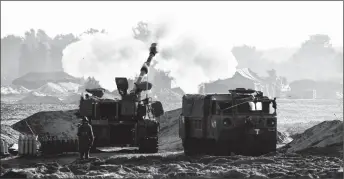  ?? ?? Israeli soldiers firing rockets Creator: AMIR COHEN | Credit: REUTERS