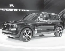  ?? PAUL SANCYA. THE ASSOCIATED PRESS ?? Kia’s Telluride is larger in stature than the Sorento, and features “suicide” doors — front and rear doors that open facing each other.