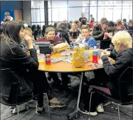  ?? MEGAN DAVIS MCDONALD COUNTY PRESS ?? The sounds of laughter and sandwich bags filled Crowder College’s Jane campus on Thursday, March 16, as students enjoyed lunch during a career fair. Sixth graders from throughout the county attended to ponder their future.