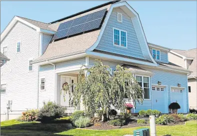  ?? Hearst Connecticu­t Media file photo ?? The solar panels on this Bartlett Hollow Road house in Middletown generate a third of the home’s electrical demand. The homeowners also use geothermal heating.