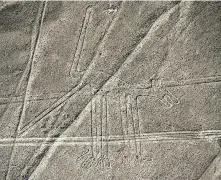  ?? Martin Bernetti / AFP / Getty Images file photo ?? One of the carvings, known as the Dog, was among the dozens of geoglyphs recently discovered in the Peruvian desert. Some of the shapes are believed to date from at least 100 B.C.