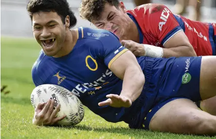  ?? PHOTO: GREGOR RICHARDSON ?? What a feeling . . . Raymond Nu’u scores a try for Otago as Tasman winger Macca Springer is left in his wake at Forsyth Barr Stadium on Saturday.