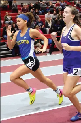  ?? Westside Eagle Observer/MIKE ECKELS ?? Decatur’s Desi Meek pushes past another runner in the home stretch of the girls’ 400-meter run during the Arkansas High School Indoor Track Meet held at the Tyson Indoor Track Complex in Fayettevil­le on Feb. 23.