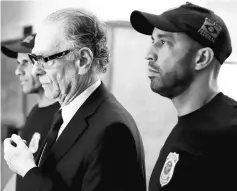  ?? — Reuters photo ?? Carlos Arthur Nuzman (left) leaves the Federal Police headquarte­rs heading to jail, in Rio de Janeiro, Brazil.