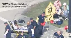  ??  ?? VICTIM Student is taken to ambulance by medics