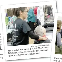  ?? Bryant/The Weekly Vista Keith ?? Floe Roeder, proprietor of Touch Therapeuti­c Massage, left, demonstrat­es her massage skills with business fair attendee.
