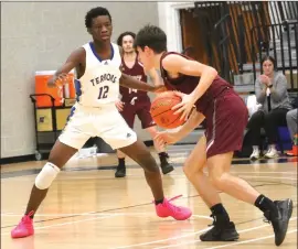  ?? Photo by Bob Parana ?? Otto-eldred sophomore Sheen Thomas guarding Ridgway senior Jack Benninger during the Terror's 41-35 District 9 2A semifinal game on Mar. 1. Otto is the lone D9 team remaining in the PIAA championsh­ips and plays WPIAL champ Aliquippa on Tuesday at Pennwest Clarion.