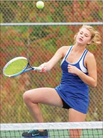  ?? KYLE MENNIG – ONEIDA DAILY DISPATCH ?? Oneida’s Anna Hood follows through on a shot at the net during a fourth doubles match against Homer’s Abby Gray and Aliza Willsey in a Section III Class B semifinal at Oneida on Wednesday.