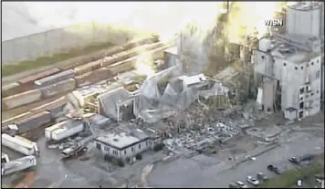  ?? WISN-TV VIA ASSOCIATED PRESS ?? Portions of Didion Milling Plant were filled with rubble Thursday in Cambria, Wis., after an explosion late Wednesday night at the site about 80 miles northwest of Milwaukee. The cause of the blast remained unknown, Didion officials said.