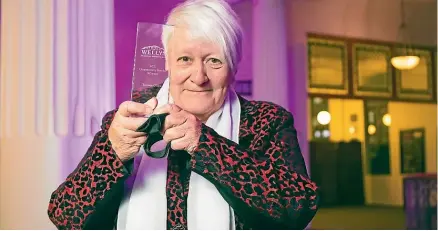  ?? Photos: JERICHO ROCK-ARCHER/STUFF ?? Wellington­ian of the Year Teresea Olsen receives her award at a ceremony in Wellington on Thursday night.