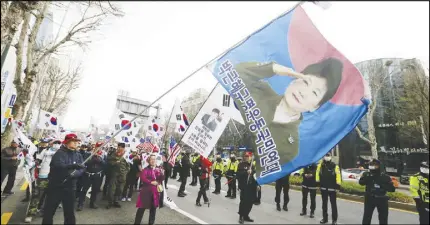  ?? AP PHOTO ?? Supporters of former South Korean President Park Geun-hye march during a rally to call for her release near the Seoul Central District Court in Seoul, South Korea.
