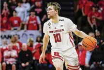  ?? Rich Schultz/Getty Images ?? Cam Spencer, a 6-foot-4 guard who graduated from Rutgers has committed to the Huskies as a much-needed perimeter threat.