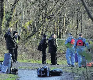  ??  ?? Police at the River Cynon, where Royston Payne’s body was found in November