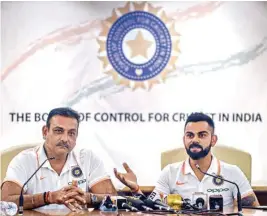  ?? PTI ?? Captain Virat Kohli along with coach Ravi Shastri during the team's Australia tour pre-departure press conference at the BCCI headquarte­rs in Mumbai on Thursday