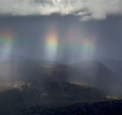  ??  ?? IN RAINBOWS
Taken on an evening of rainbows whilst returning from Beinn an Eoin in Torridon. Often, I have been forced to enjoy the peaks of Fisherfiel­d from afar when the weather windows have been too short to justify a long trip into the mountains.